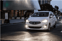 Mitsubishi MIrage G4 traveling through city