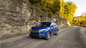 Outlander Sport driving down road