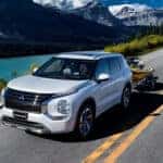 White Mitsubishi Outlander towing a jet ski