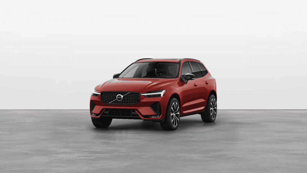 Front three-quarter view of a red 2025 Volvo XC60 in a clean studio setting, emphasizing its sporty exterior styling.