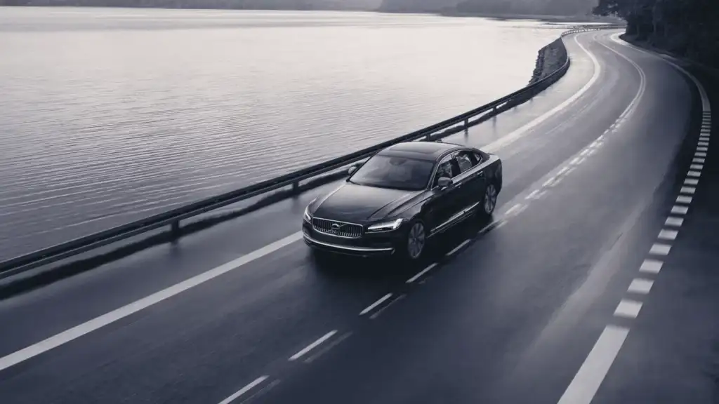 2025 Volvo S60 sedan parked in a modern urban setting near Bristol, TN, highlighting its clean lines, driver-assist features, and smart tech styling.
