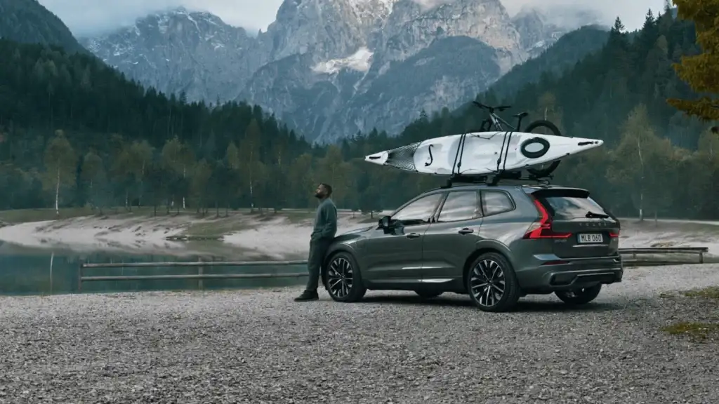2025 Volvo XC60 in Bristol TN with roof-mounted kayak and bicycle, designed for outdoor lifestyle and premium comfort.