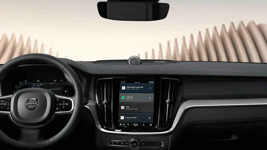 Dashboard view of the 2025 Volvo V60 Cross Country featuring a central infotainment touchscreen and integrated smartphone connectivity.