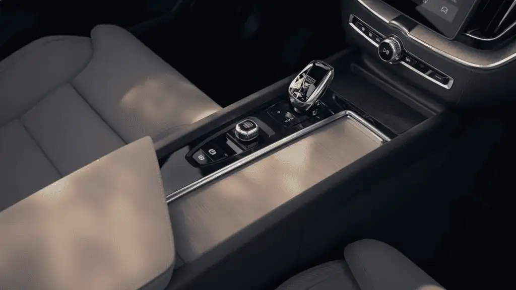 2025 Volvo XC60 Plug-In Hybrid driving on an open road, highlighting efficient powertrain engineering and hybrid system technology.