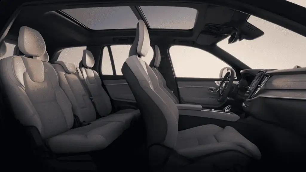 Luxurious interior of the 2025 Volvo XC90 Plug-In Hybrid showcasing spacious seating, panoramic sunroof, and Scandinavian-inspired cabin design.