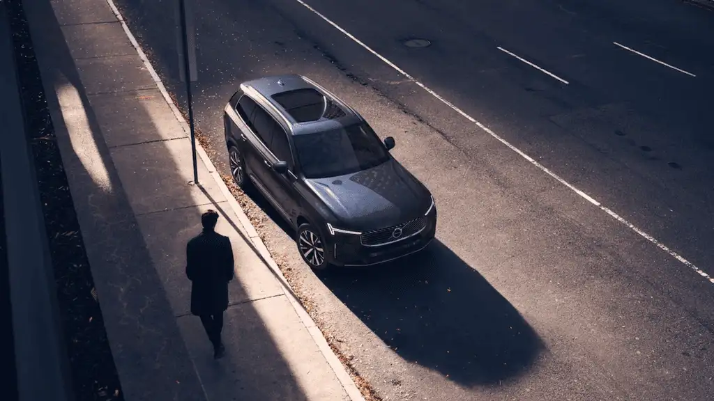 2025 Volvo XC90 Plug-In Hybrid parked on a quiet Bristol TN street, featuring modern Scandinavian styling and advanced hybrid efficiency.
