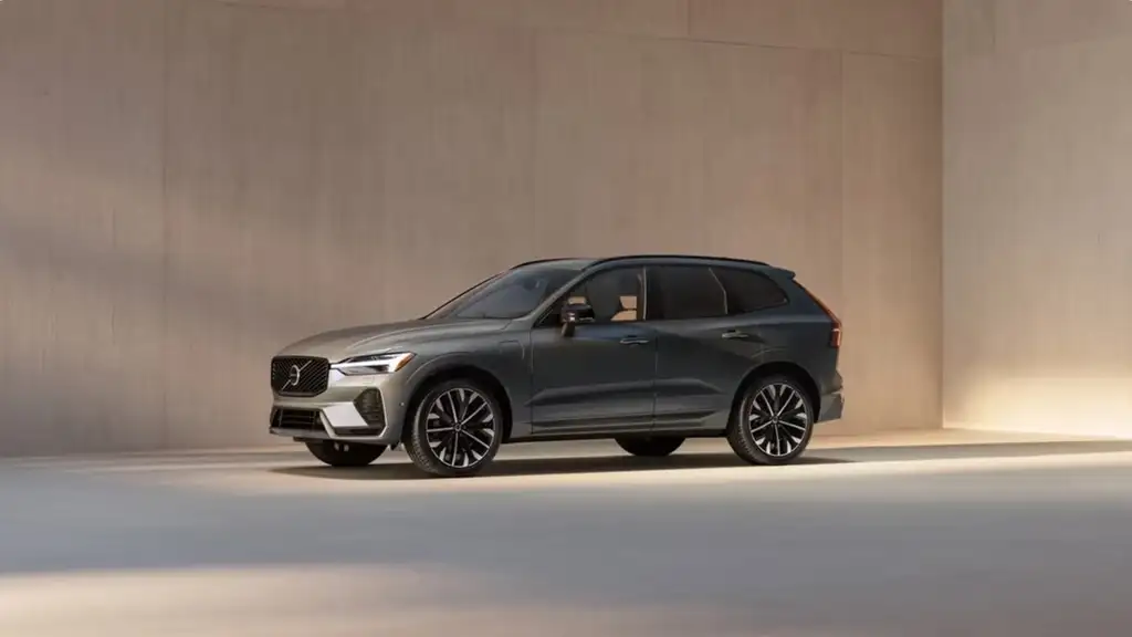 2025 Volvo XC60 Plug-In Hybrid parked in a modern indoor setting, showcasing its sleek exterior for Bristol TN year-end buyers.