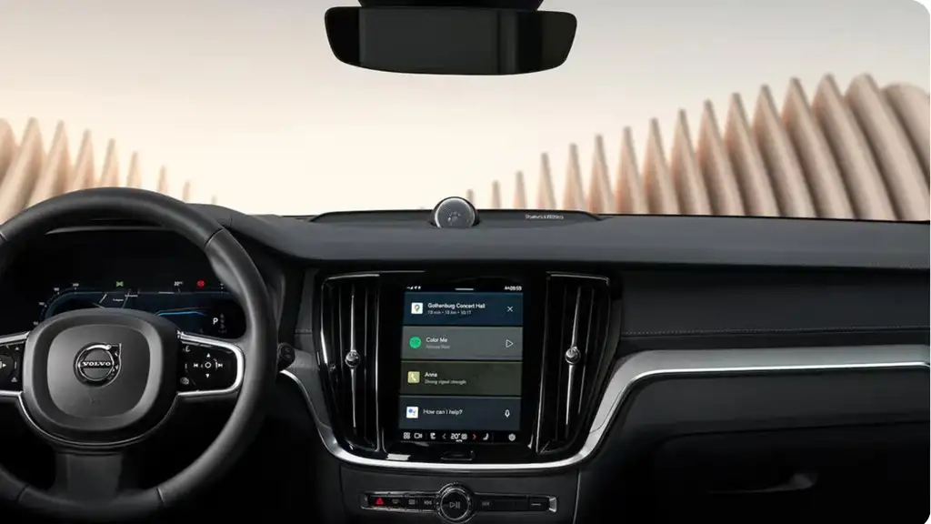 Driver-focused cockpit of the 2026 Volvo V60 Cross Country featuring a digital touchscreen display, steering controls, and modern infotainment system.