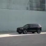 2026 Volvo XC40 parked beside a modern concrete wall, featuring compact SUV design and confident winter driving capability for Bristol, TN commuters.