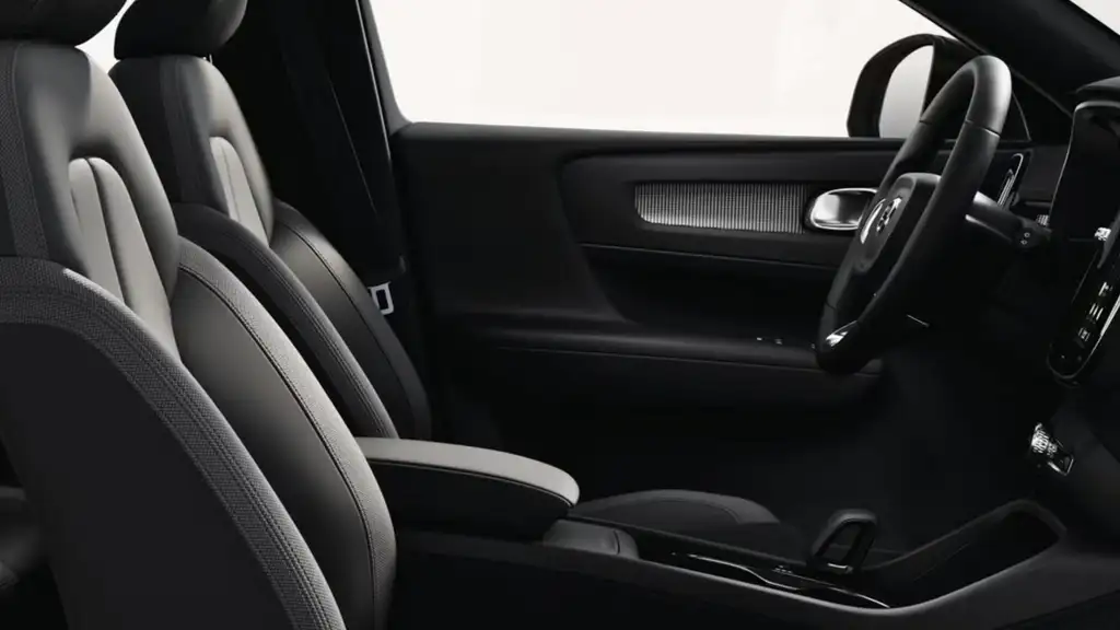 2026 Volvo EX40 interior layout with front seats, center console, and spacious cabin design highlighting ergonomic seating and clean dashboard styling