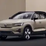 2026 Volvo XC90 Plug-In Hybrid AWD parked near the coast with a kayak on the roof, highlighting weekend travel and outdoor capability for Bristol, TN drivers.