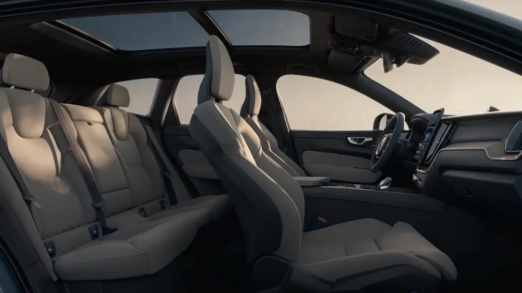 2026 Volvo XC60 interior cabin featuring supportive seats, panoramic roof, and functional Scandinavian design