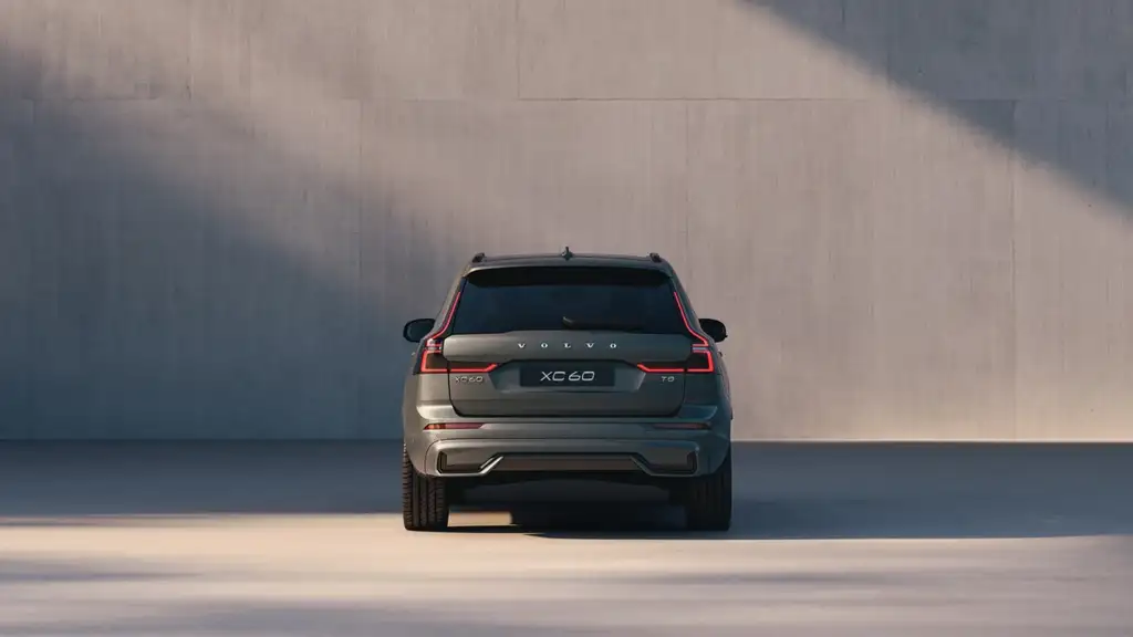 Rear view of the 2026 Volvo XC60 Plug-in Hybrid showing clean exterior lines, LED tail lights, and refined luxury SUV design.