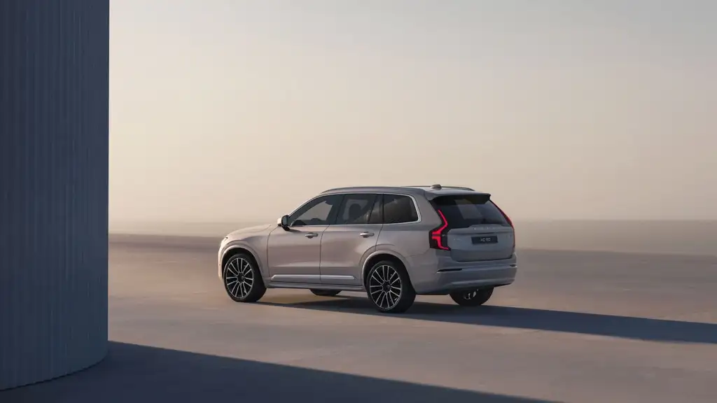 2026 Volvo XC90 in silver showing rear three-quarter view on an open road near Johnson City, TN.
