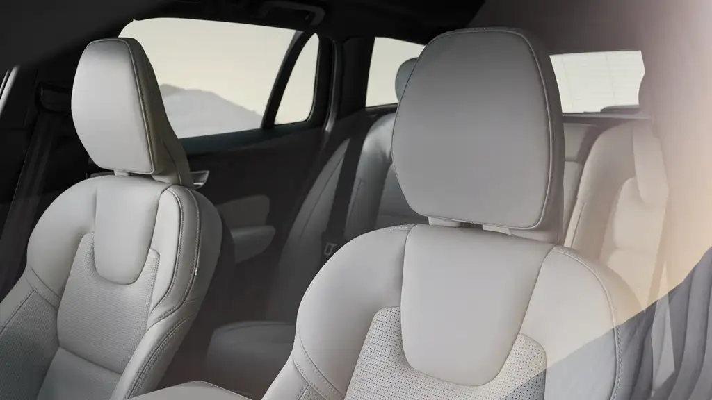2026 Volvo V60 Cross Country interior showing premium perforated light gray leather front and rear passenger seats near Asheville NC