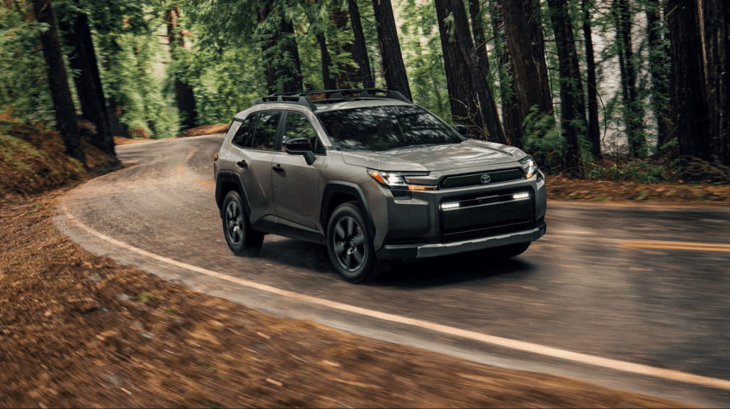 The 2026 Toyota RAV4 driving in a forest