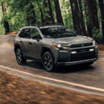 The 2026 Toyota RAV4 driving in a forest