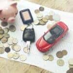 Toy car, coins, and keys representing Toyota financing