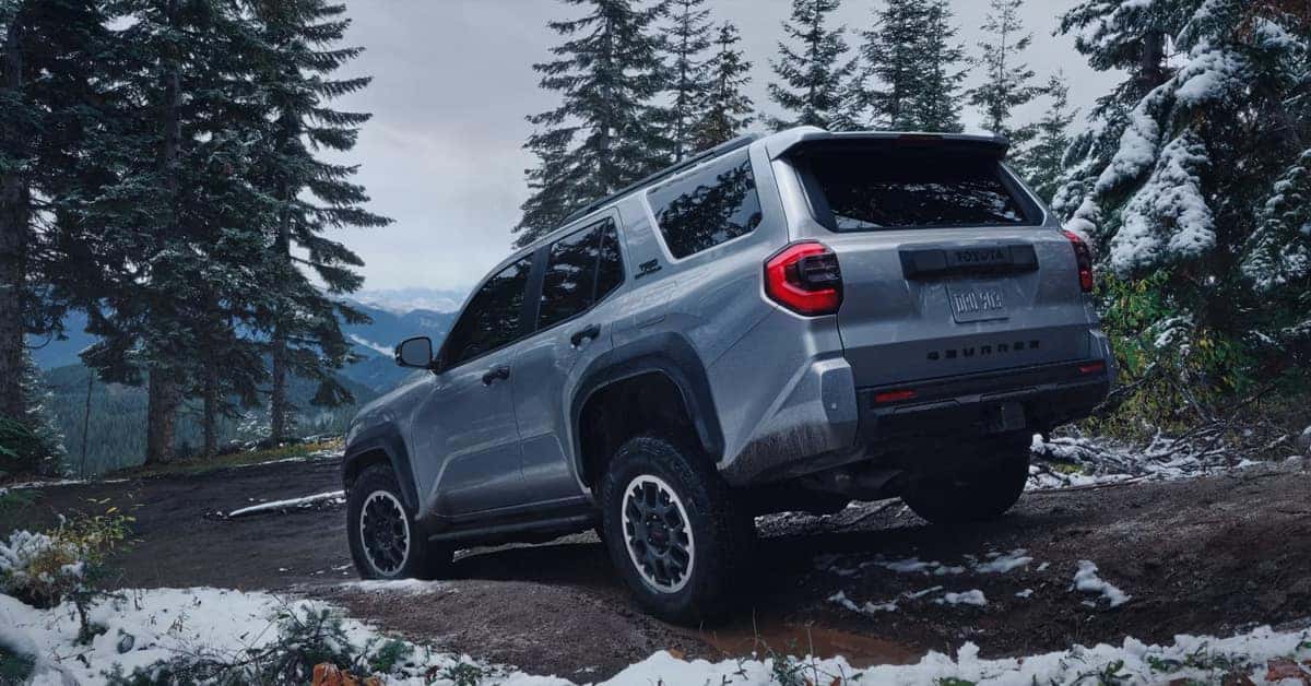 2026 Toyota 4Runner - navigating a muddy, snow-dusted forest path