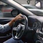 Man driving in Nissan Altima