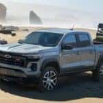 Gray 2023 Chevy Colorado Towing a Trailer on a Beach
