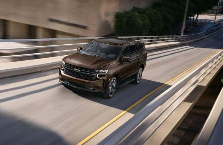 Brown 2024 Chevy Tahoe Front on a Freeway