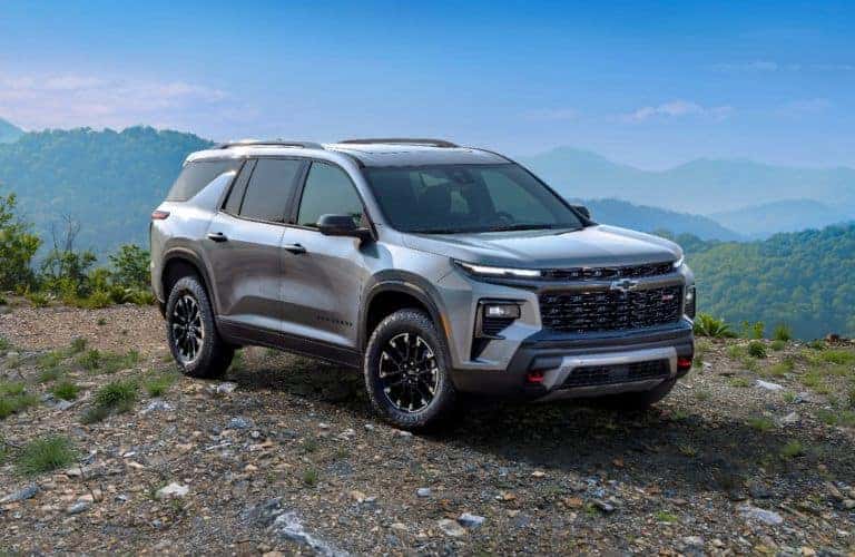 Silver 2024 Chevy Traverse on a Trail
