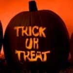 Halloween Jack-O-Lanterns Lit Up with Trick or Treat on the Middle Pumpkin