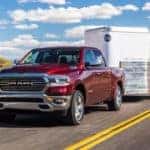 2019 Ram 1500 towing trailer on road