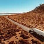 International LT midground aerial driving curve road desert lake mountain