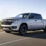 2025 Ram 1500 Ramcharger Truck driving down a highway