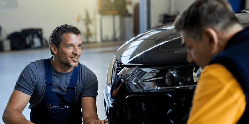 Professional mechanic performing advanced diagnostics on a vehicle