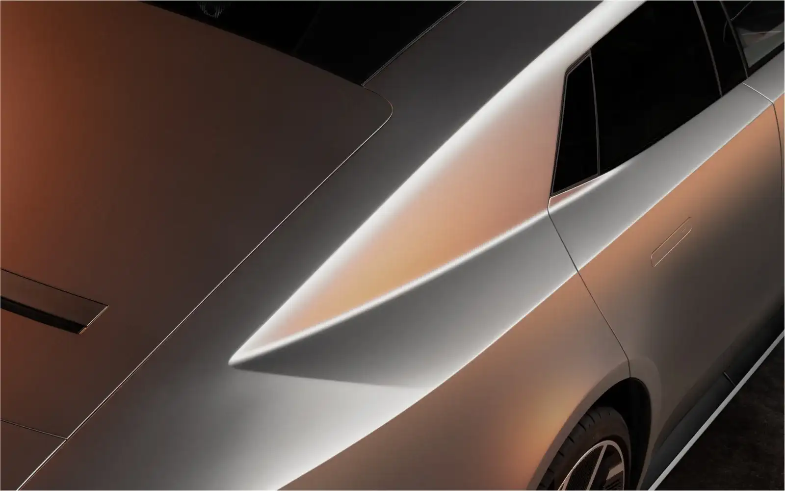 Close-up of the sculpted rear haunch and C-pillar on a silver Jaguar Type 01