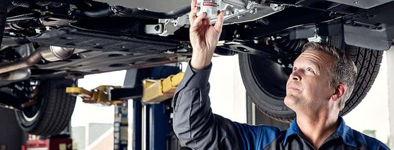 Person under a vehicle performing inspection