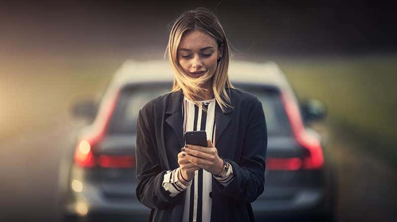 Person Navigating Volvo Cars App