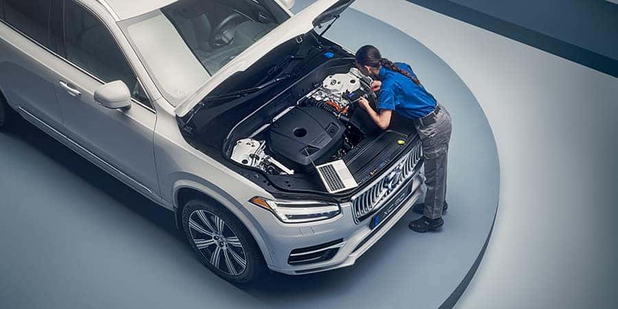 Person looking inside engine bay Volvo Service