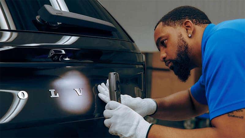Technician working on a Volvo vehicle