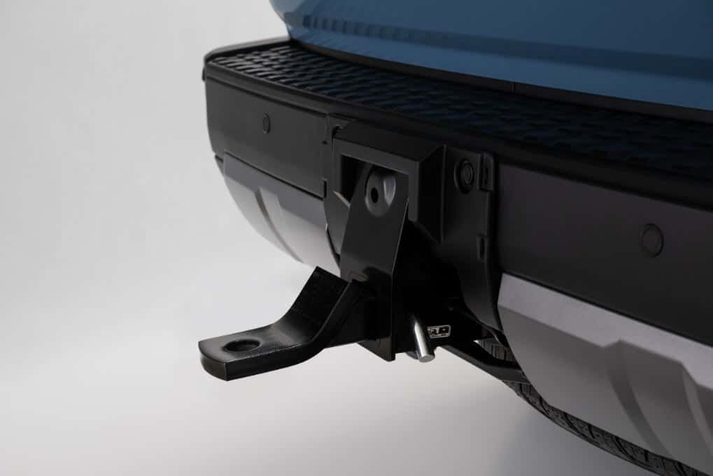 Close-up of the integrated tow hitch receiver on a blue 2027 Toyota Land Cruiser at Joseph Airport Toyota in Vandalia, Ohio
