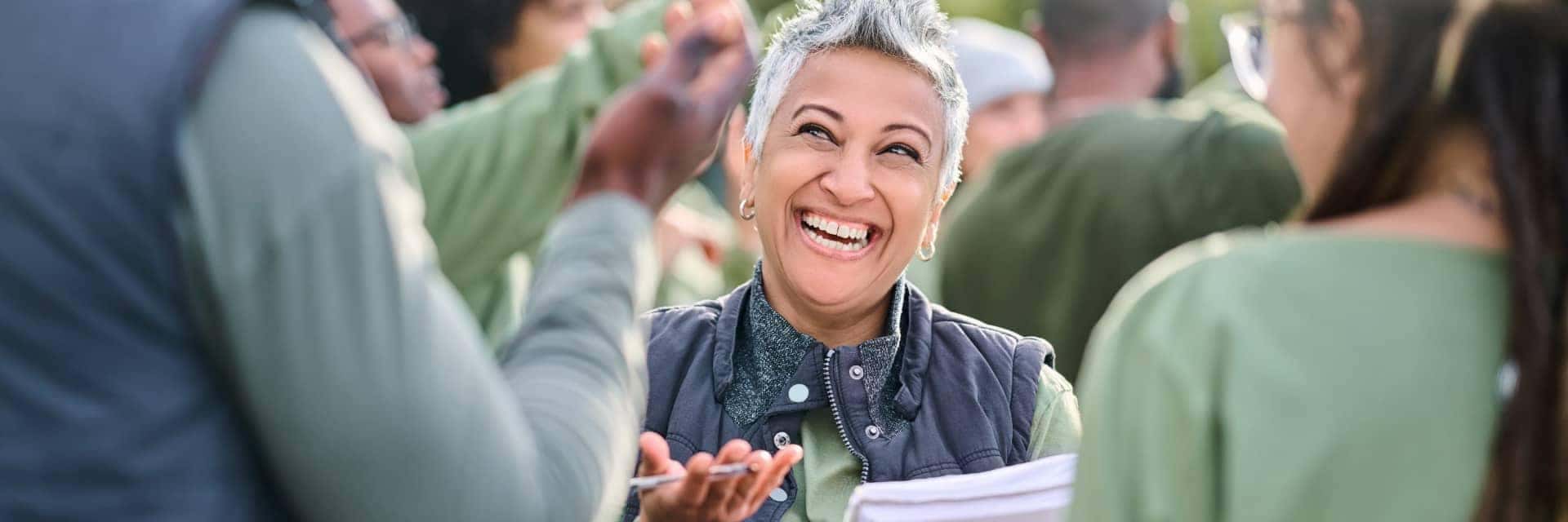 Happy people wearing green at a community service event