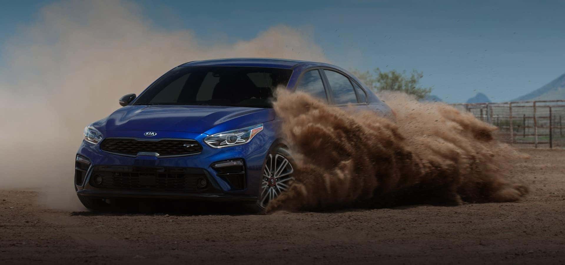 Kia_Forte_Blue_GT_Driving_On_Dirt