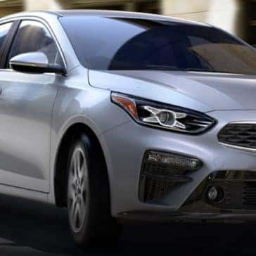 Kia_Forte_Silver_Driving_In_CIty