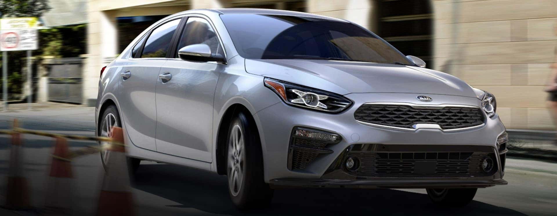 Kia_Forte_Silver_Driving_In_CIty
