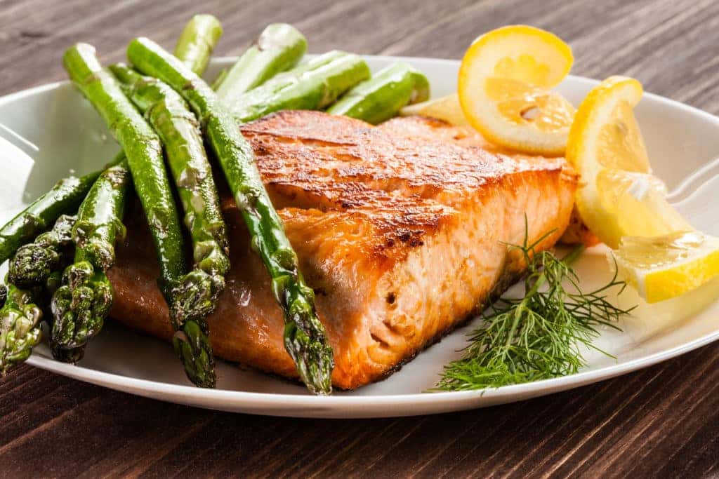 grilled salmon with greens at a restaurant