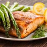 grilled salmon with greens at a restaurant