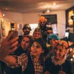 group of friends posing for a picture in costumes