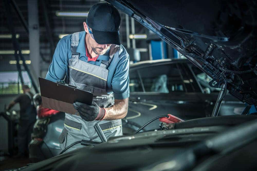 Technician Inspecting Vehicle