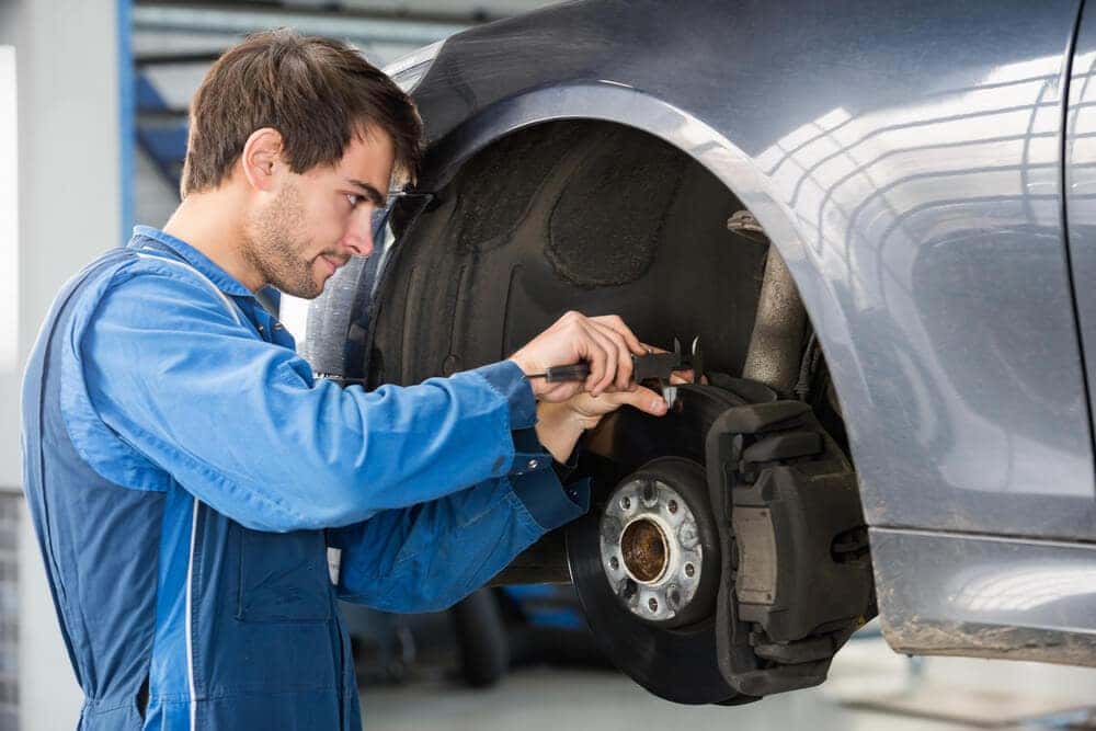 Certified MINI technicians performing brake repair