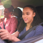 teen and mother driving car