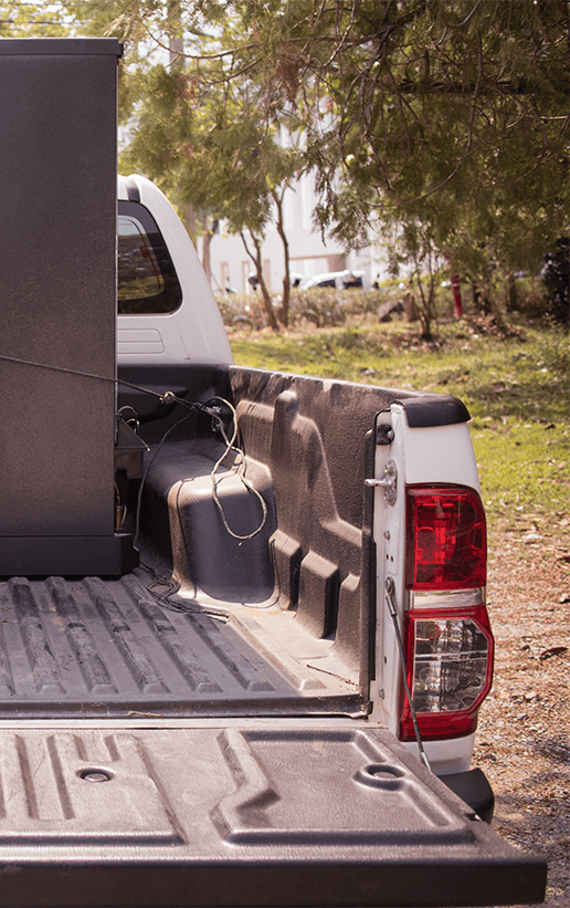 Accessories that help keep your Dodge ,Chrysler, Jeep, Ram protected at Stetler DCJR in York, PA | Rear trunk bed of a white pick up trunk