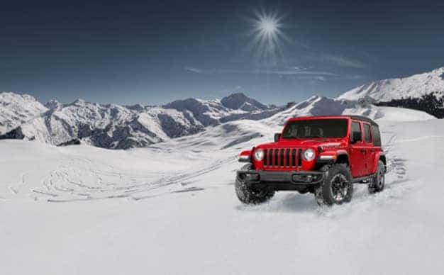 3 Main Benefits of Using OEM parts for your vehicle at Stetler DCJR in York, PA | Red Jeep Wrangler driving on snowy mountain